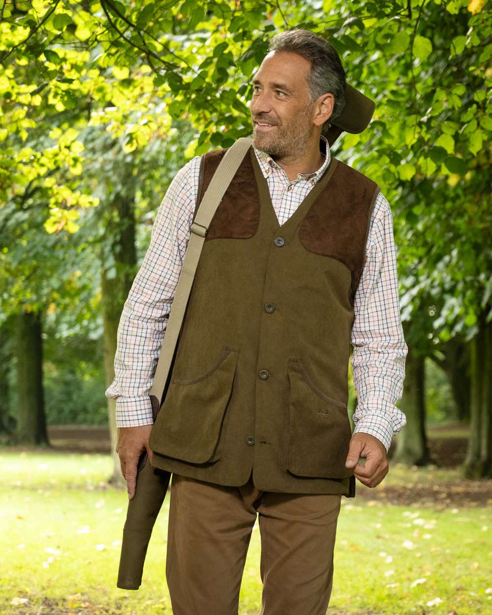 Pine Green Coloured Baleno Dolman Gilet on garden background 