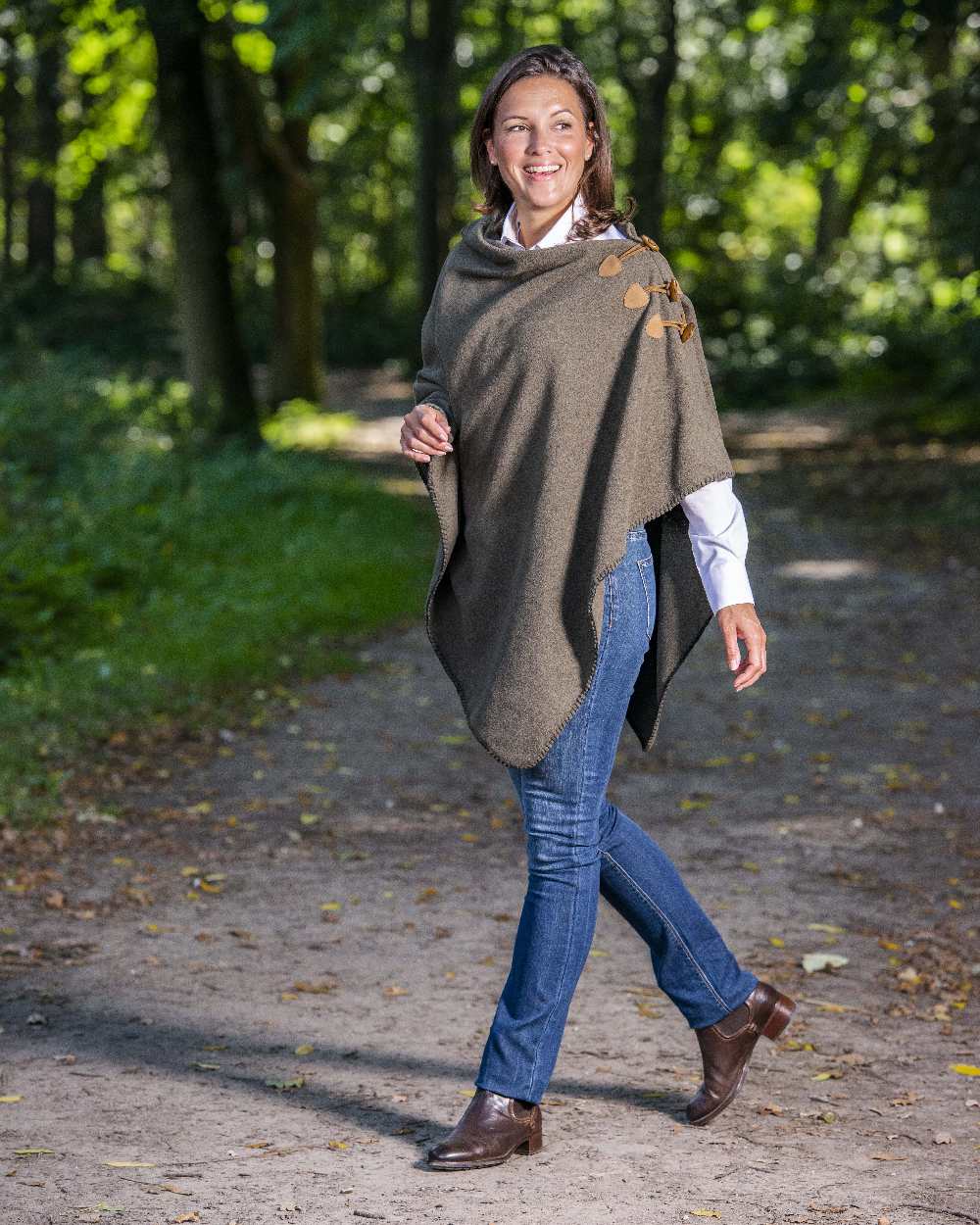 Moss Green Coloured Baleno Elite Fleece Poncho on forest background 