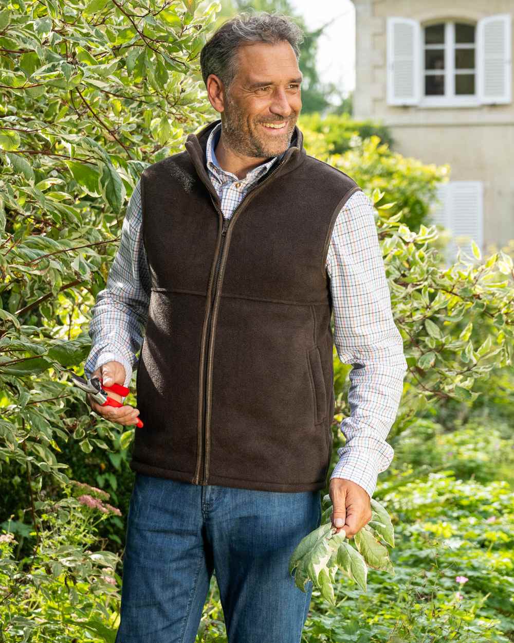 Chocolate Coloured Baleno Harvey Fleece Gilet on garden background 