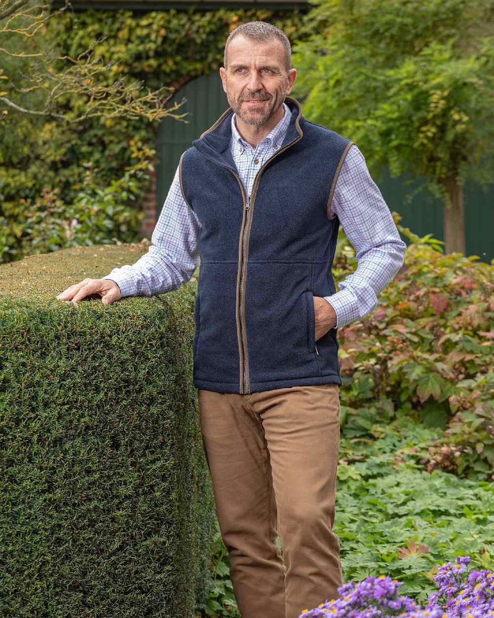 Navy Blue Coloured Baleno Holt Mens Fleece Gilet on garden background 