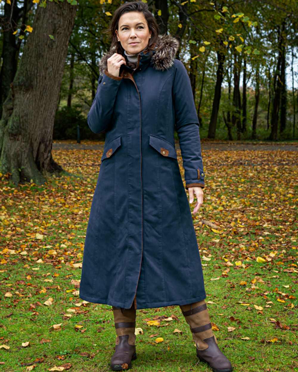 Dark Blue coloured Baleno Kensington Warm Long Waterproof Coat on countryside background 