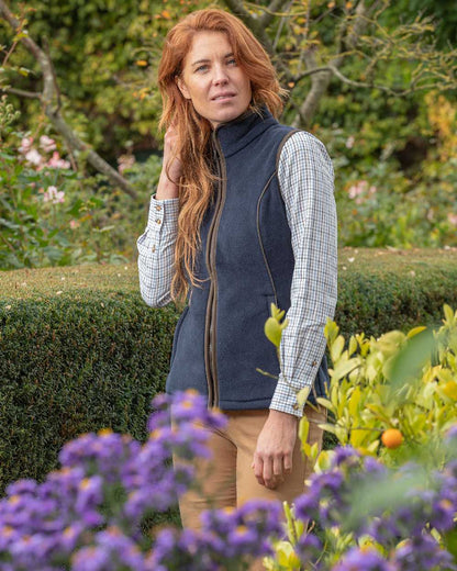 Navy Blue Coloured Baleno Ladies Surrey Fleece Gilet on garden background 