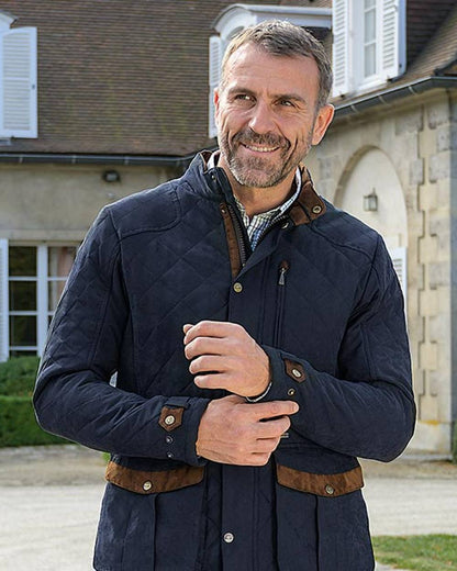 Navy Blue coloured Baleno Mens Goodwood Quilted Jacket on building background 