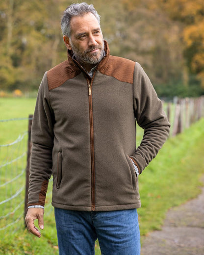 Moss Green Coloured Baleno Mens Woodlands Fancy Fleece Jacket With Waterproof Lining on countryside background 