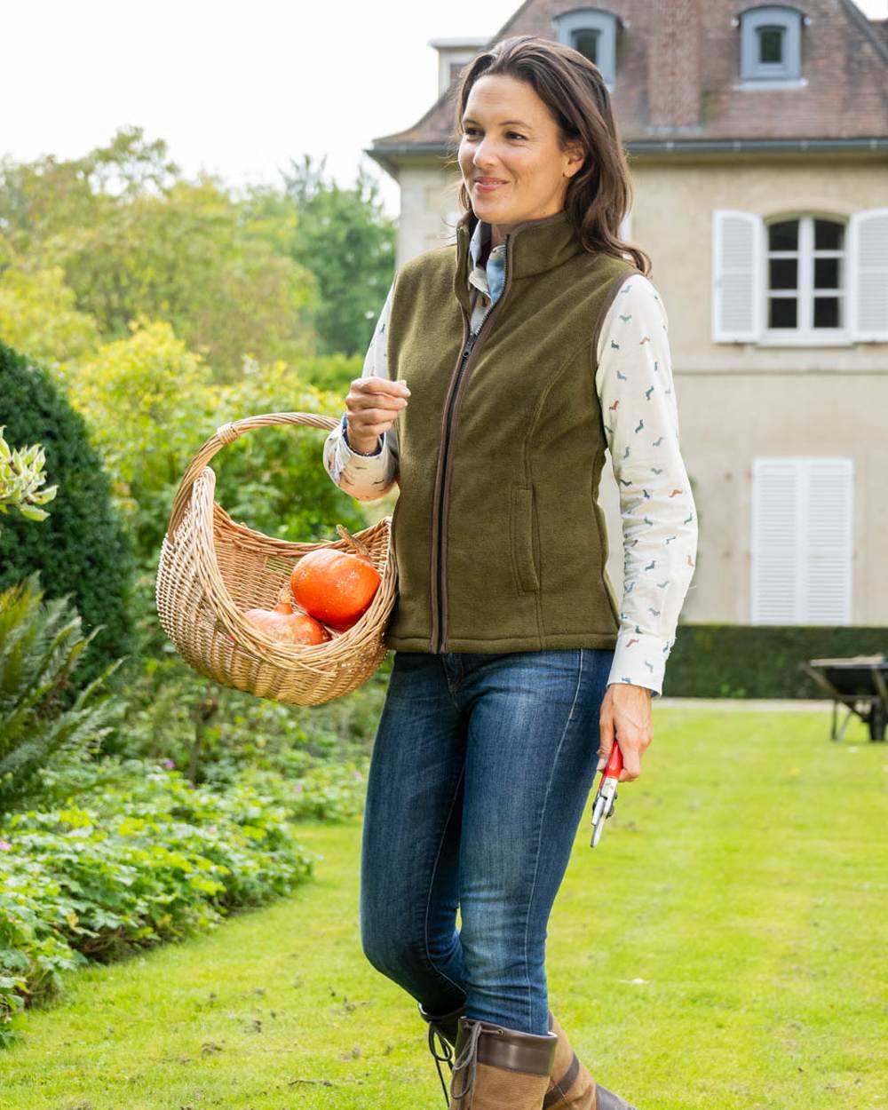 Olive coloured Baleno Sally Ladies Fleece Gilet on garden background 