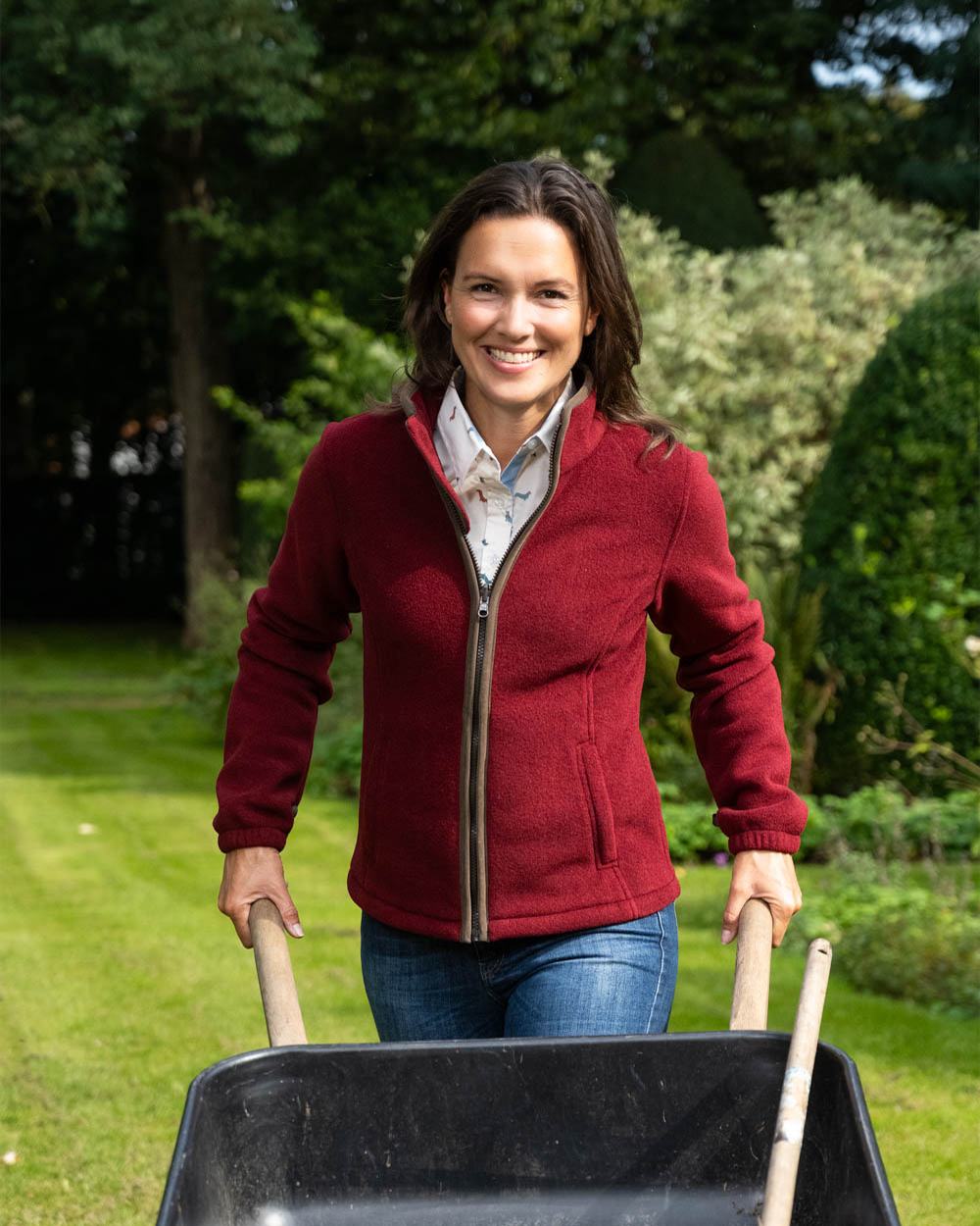 Burgundy Coloured Baleno Sarah Fleece Jacket on garden background 