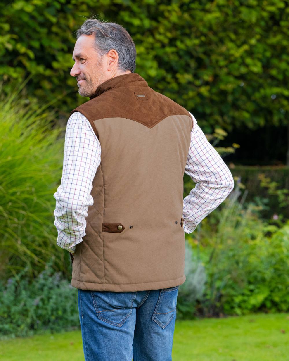 Camel Coloured Baleno Scott Quilted Mens Bodywarmer on countryside background 