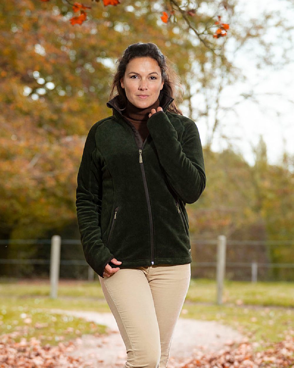 Olive Coloured Baleno Southwell Waterproof Fleece Jacket on blurry background 