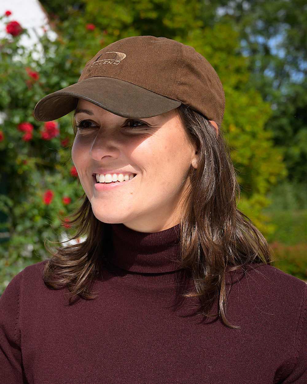 Brown Coloured Baleno Stratford Cap on garden background 