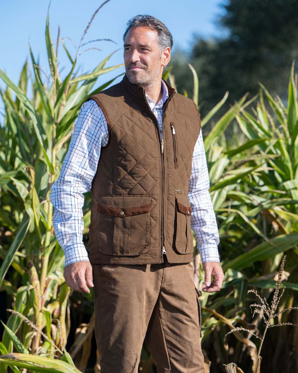 Earth Brown Coloured Baleno Thames Quilted Bodywarmer on farm background 