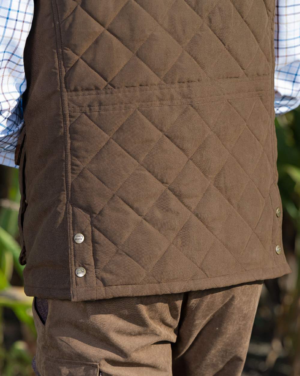 Earth Brown Coloured Baleno Thames Quilted Bodywarmer on blurry background 