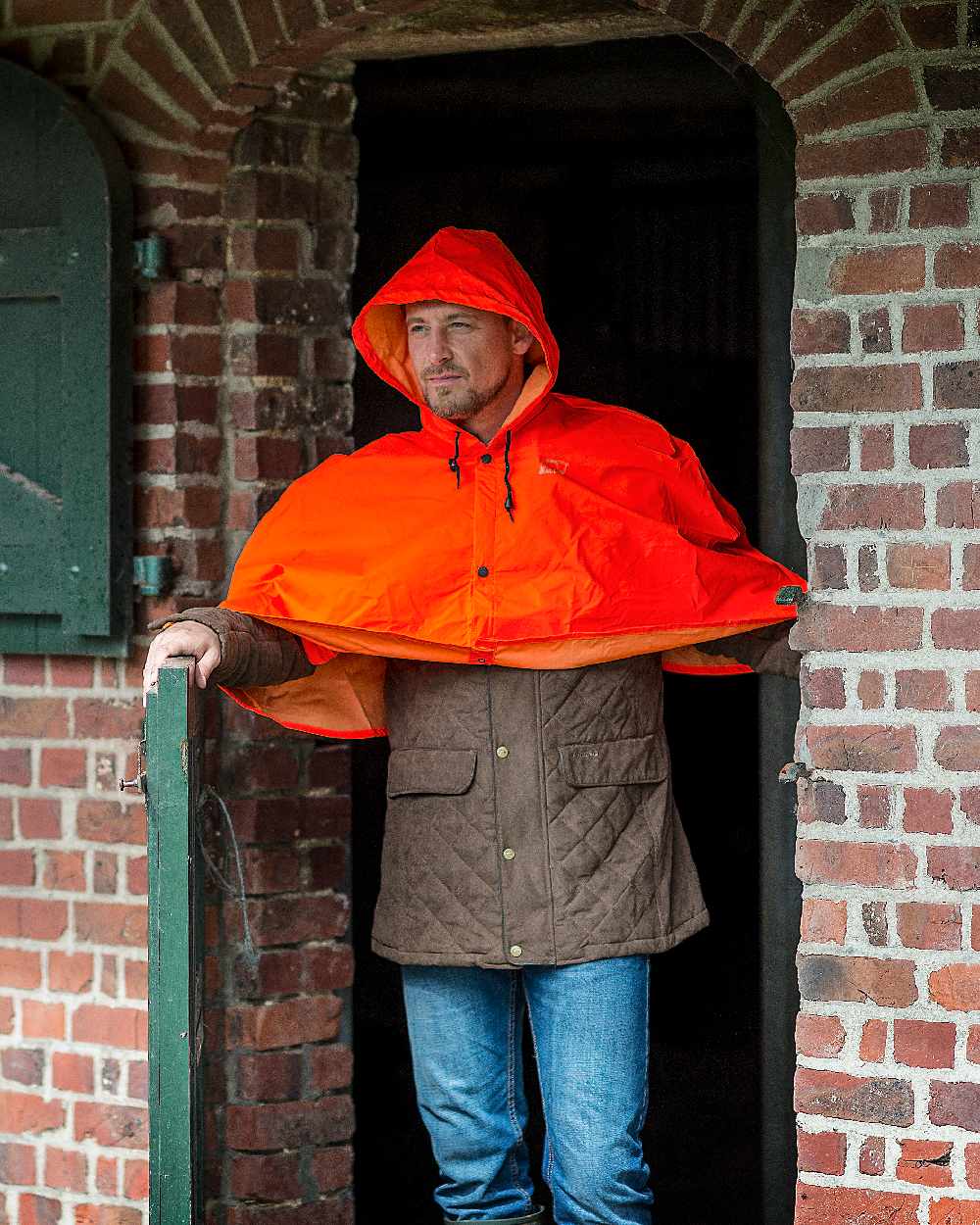 Hi-Vis Orange Coloured Baleno Torrent Cape on door background 