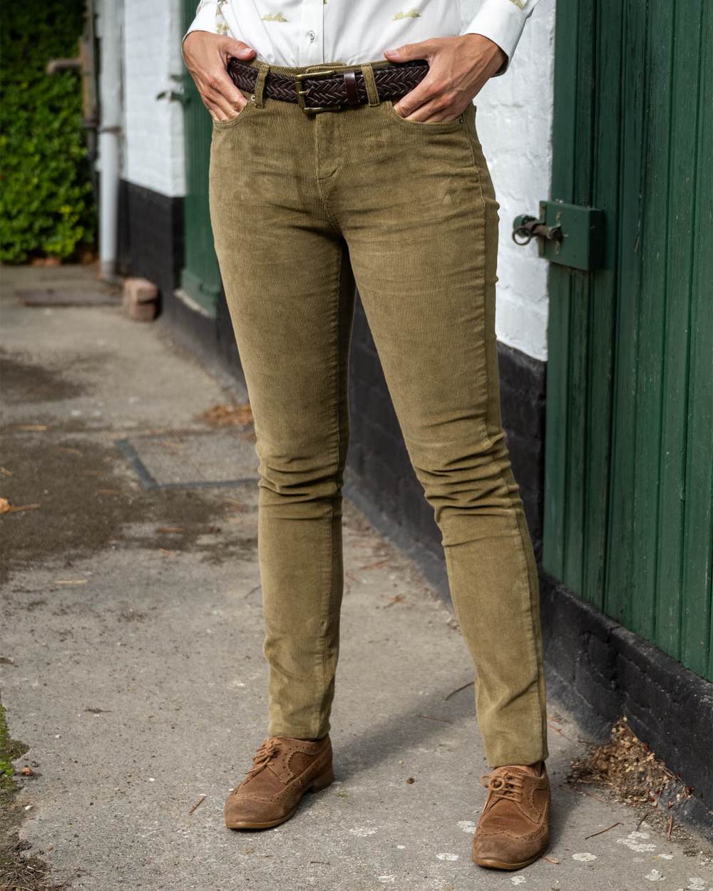 Gothic Olive Coloured Baleno Valentine Ladies Corduroy Trousers on wall background 