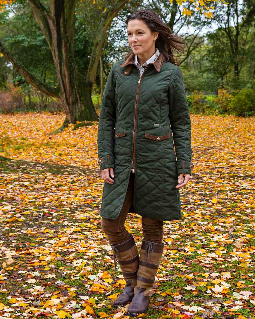 Dark Olive Green Coloured Baleno Womens Audrey Fashionable Quilted Ladies Coat on garden background 