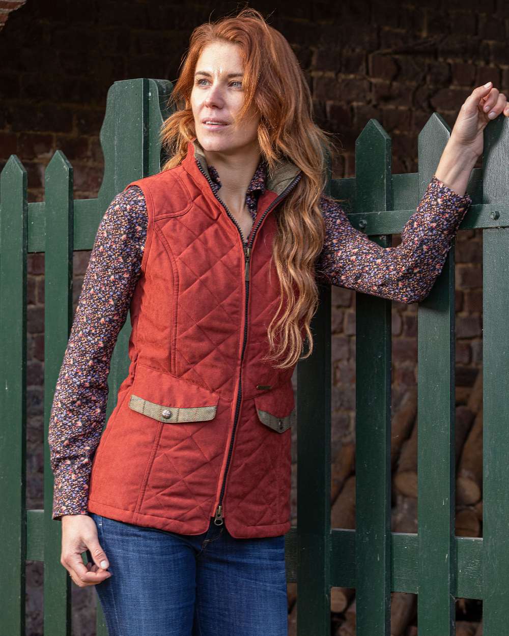 Brick Coloured Baleno Womens Chester Quilted Bodywarmer on door background 