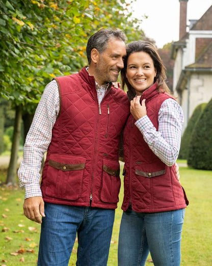 Burgundy Coloured Baleno Womens Chester Quilted Bodywarmer on house background 