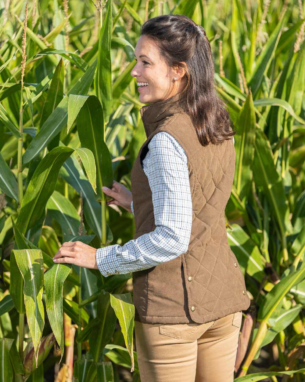 Earth Brown Coloured Baleno Womens Chester Quilted Bodywarmer on farm background  