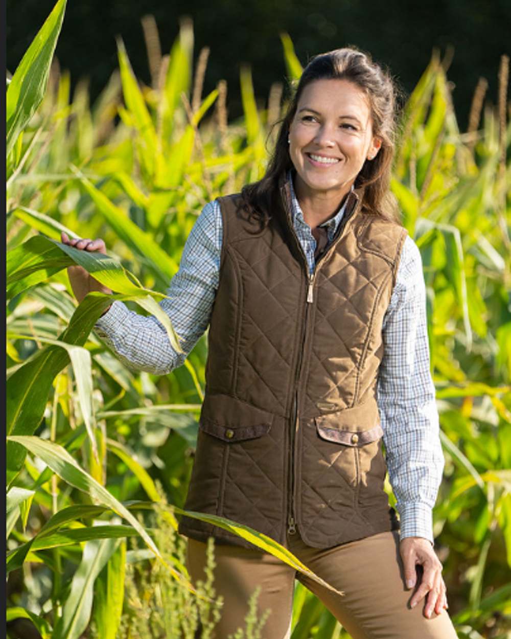 Earth Brown Coloured Baleno Womens Chester Quilted Bodywarmer on farm background  