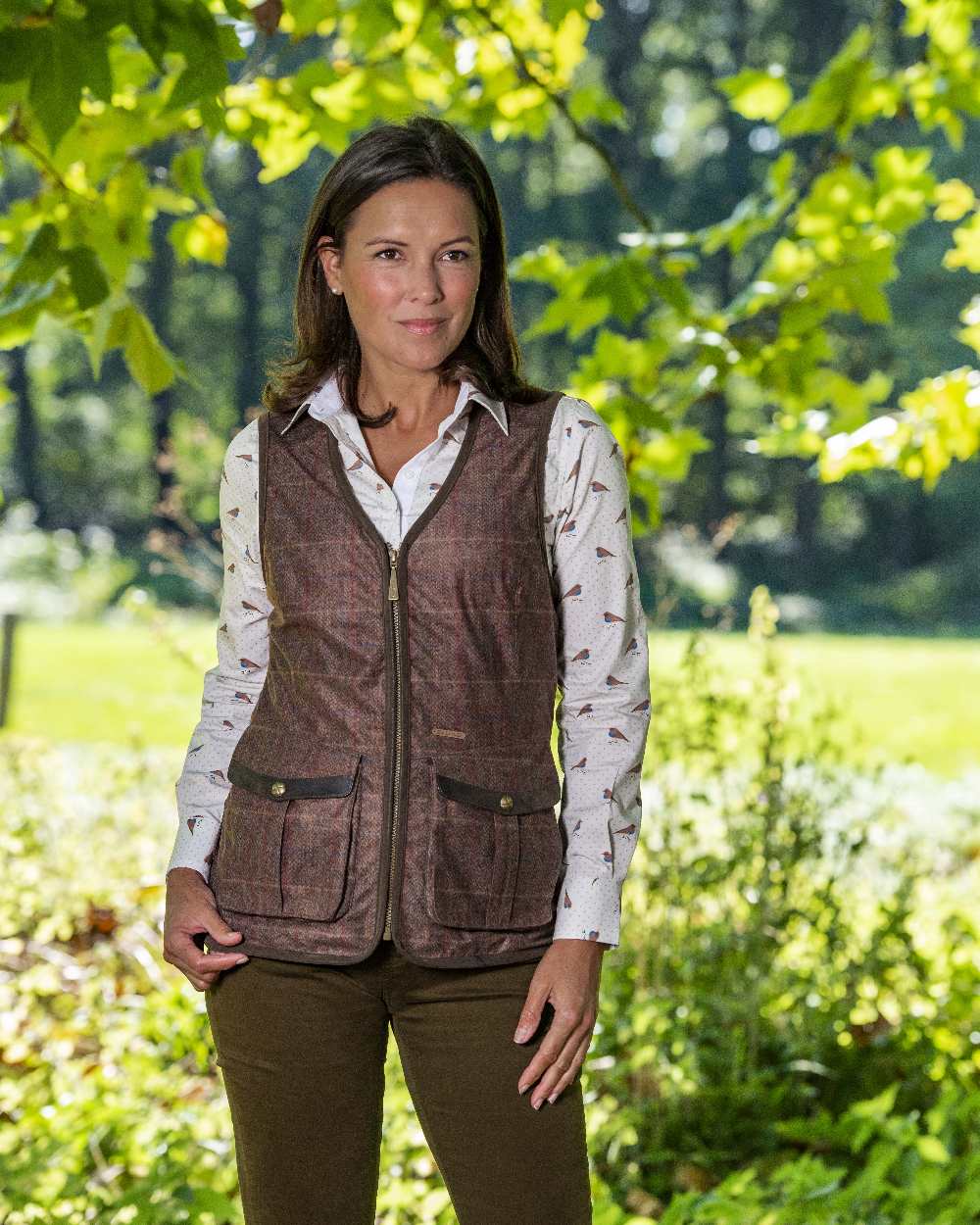 Check Brown Coloured Baleno Womens Kenwood Shooting Vest on forest background 