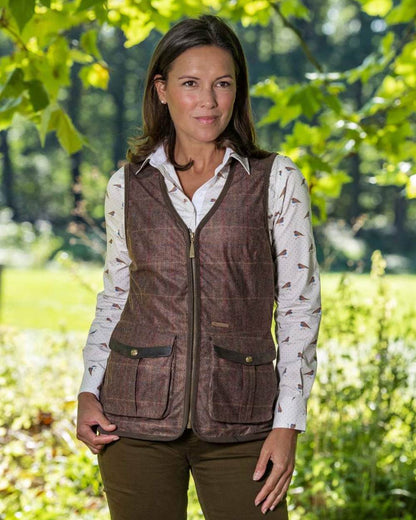 Check Brown coloured Baleno Womens Kenwood Shooting Vest on blurry background 
