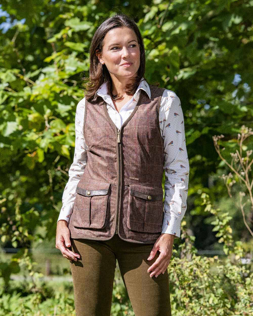 Check Brown Coloured Baleno Womens Kenwood Shooting Vest on forest background 