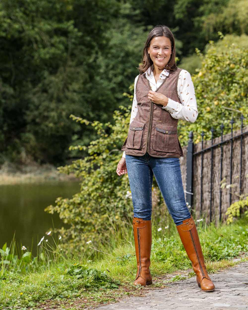 Check Brown Coloured Baleno Womens Kenwood Shooting Vest on pond background 