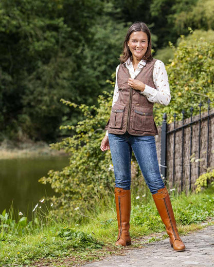 Check Brown Coloured Baleno Womens Kenwood Shooting Vest on pond background 