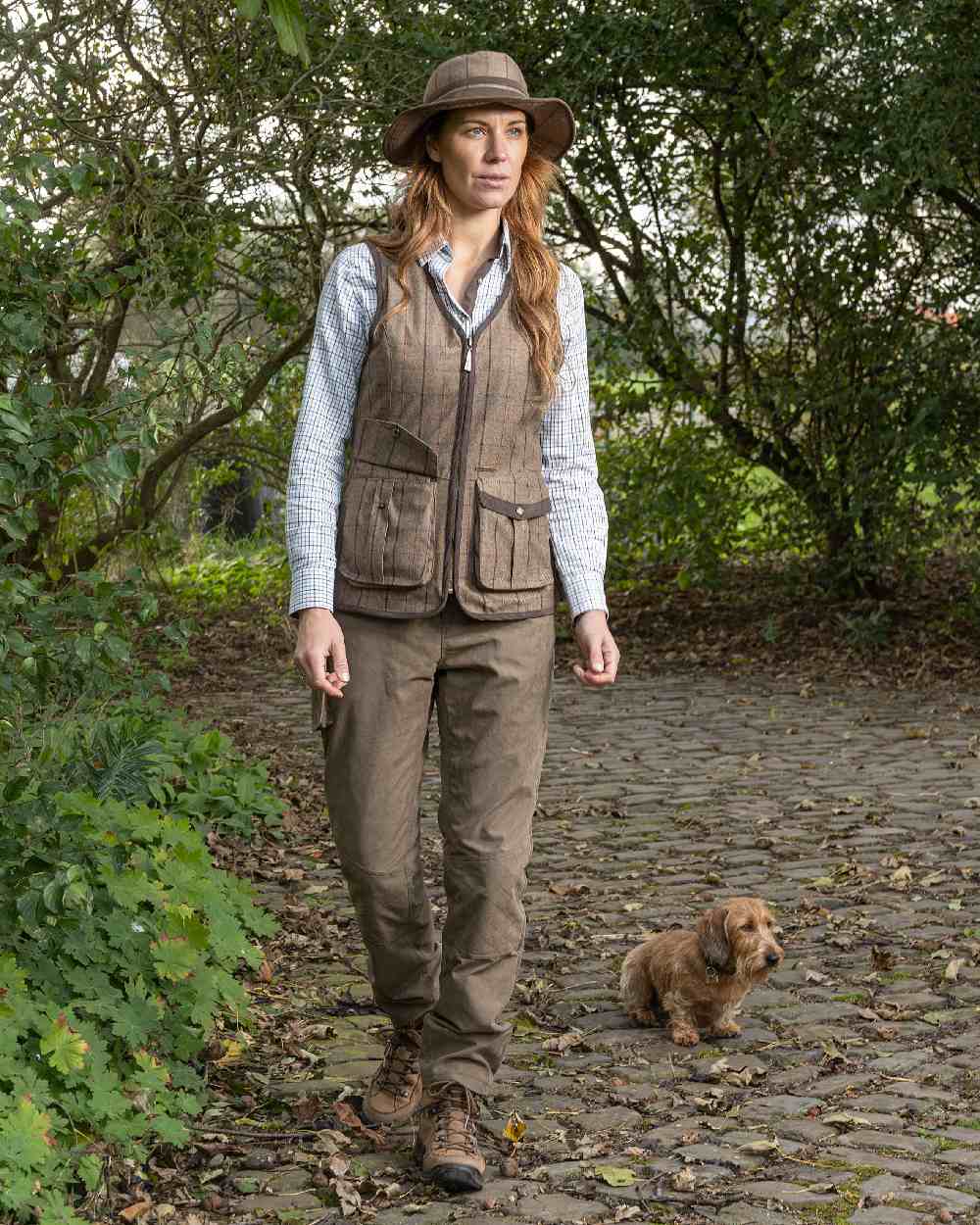 Check Khaki Coloured Baleno Womens Kenwood Shooting Vest on countryside background 