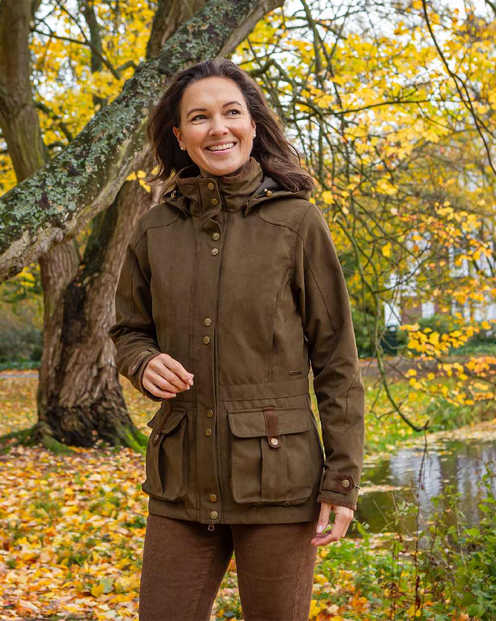 Pine Green Coloured Baleno Womens Ladywood Fashionable Country Jacket on countryside background 