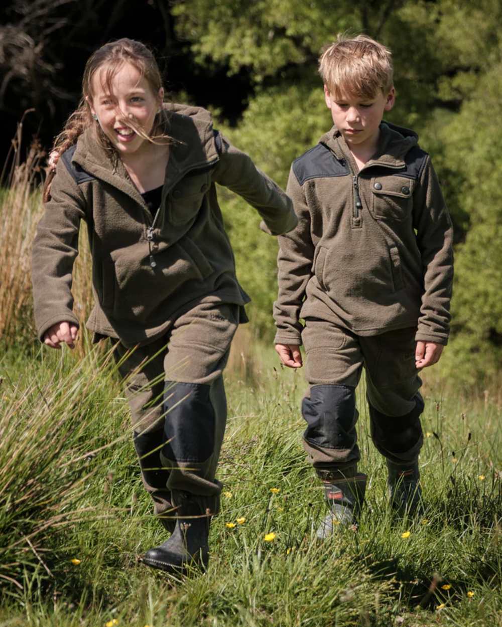Khaki Black coloured Betacraft Childrens Quest Fleece Bushshirt on forest background 