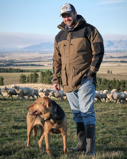 Taupe coloured Betacraft Mamaku Jacket on mountain background 