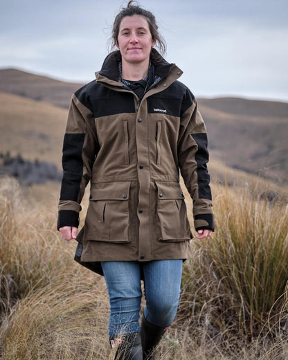 Taupe coloured Betacraft Mamaku Jacket on mountain background 