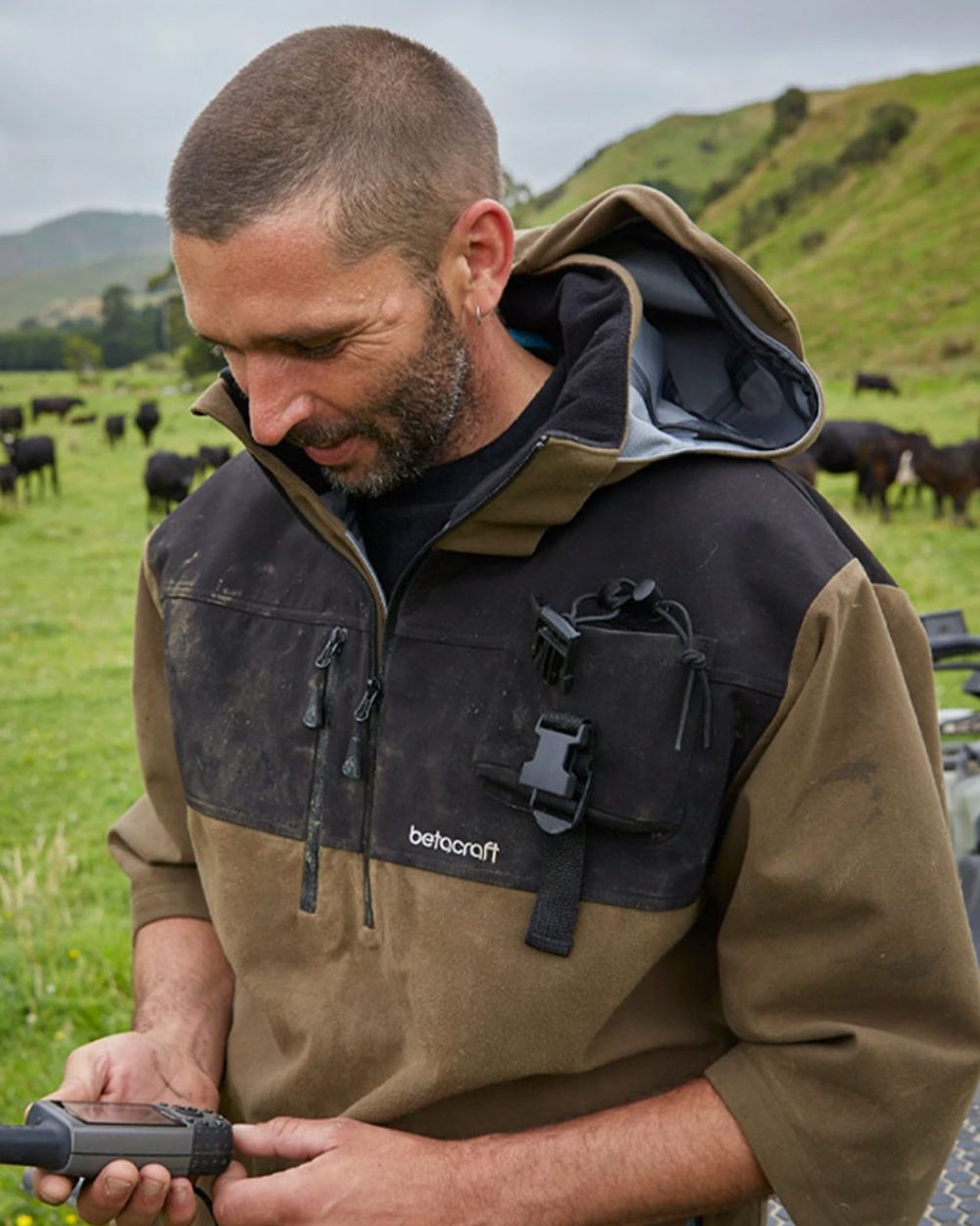 Taupe coloured Betacraft Mamaku Smock on mountain background 