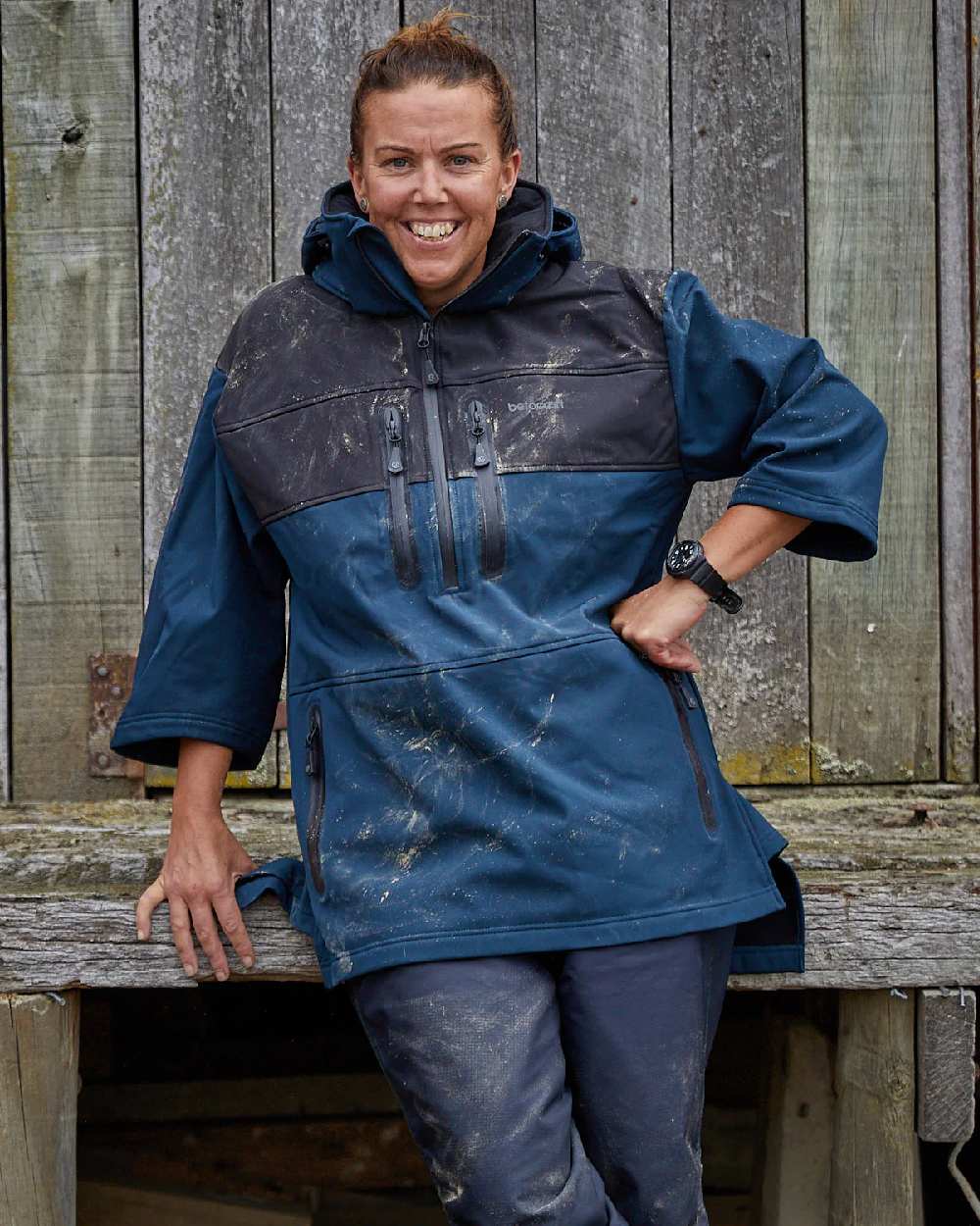 Navy coloured Betacraft Mens Husk Anorak on factory background 