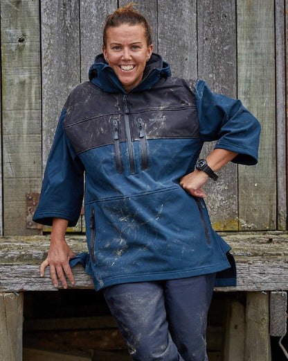 Navy coloured Betacraft Mens Husk Anorak on factory background 