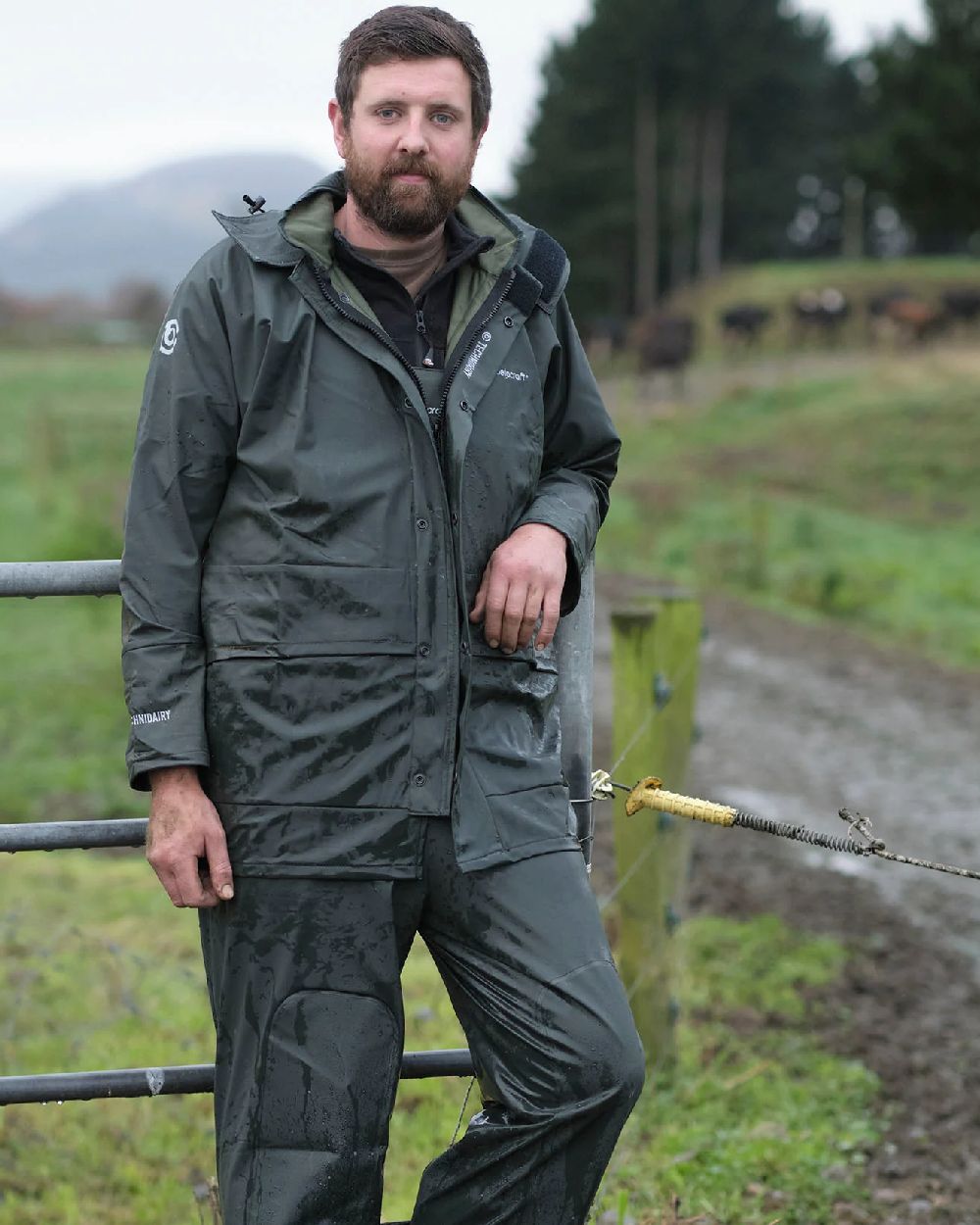 Green coloured Betacraft Mens Technidairy Overtrousers on farm background 