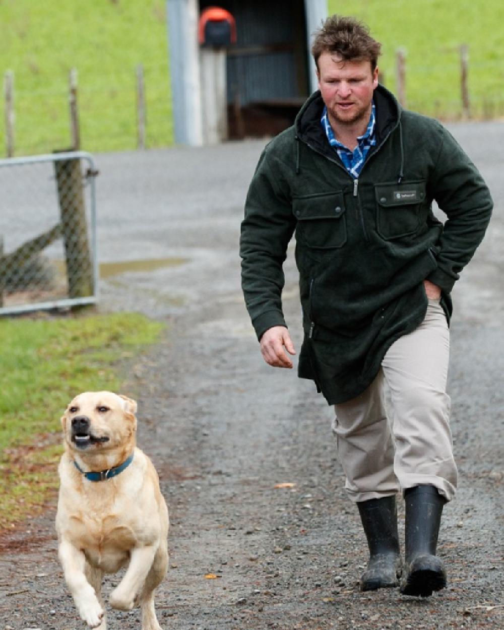 Green coloured Betacraft Mens Technifleece Bush Shirt on street background 