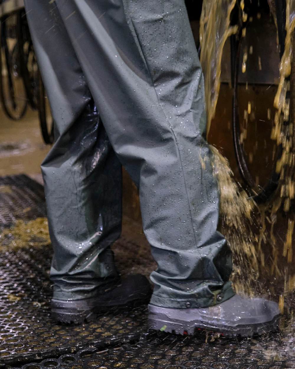 Green coloured Betacraft Technidairy Bib Overtrousers on stable background 