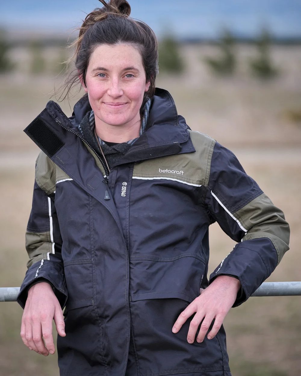 Black Saddle coloured Betacraft Womens ISO940 ECO Waterproof Parka on blurry background 