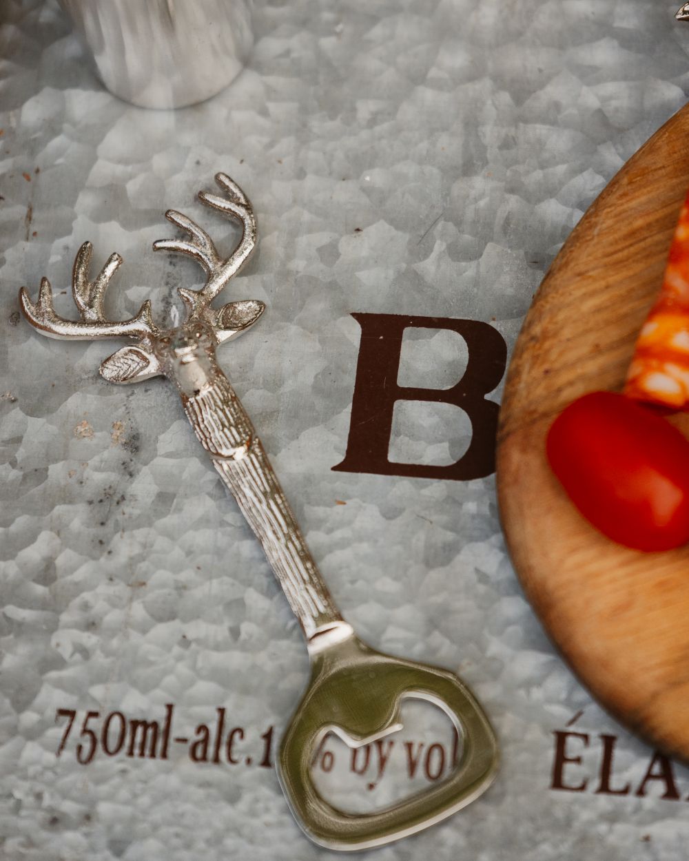 Stag Style Bisley Bottle Opener Stainless Steel on table background 