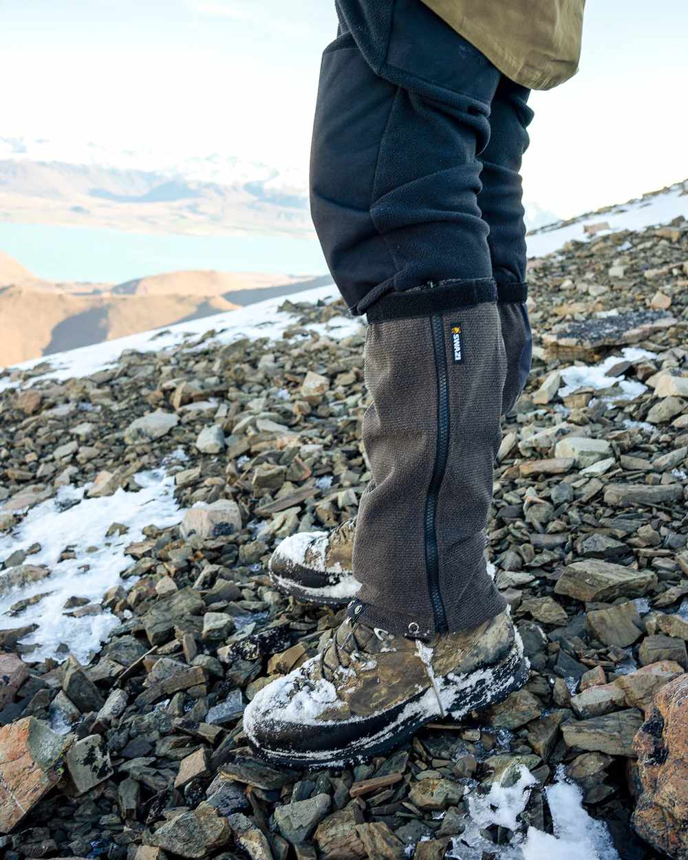 Black Coloured Swazi Ali-Gaiters On A mountain Background