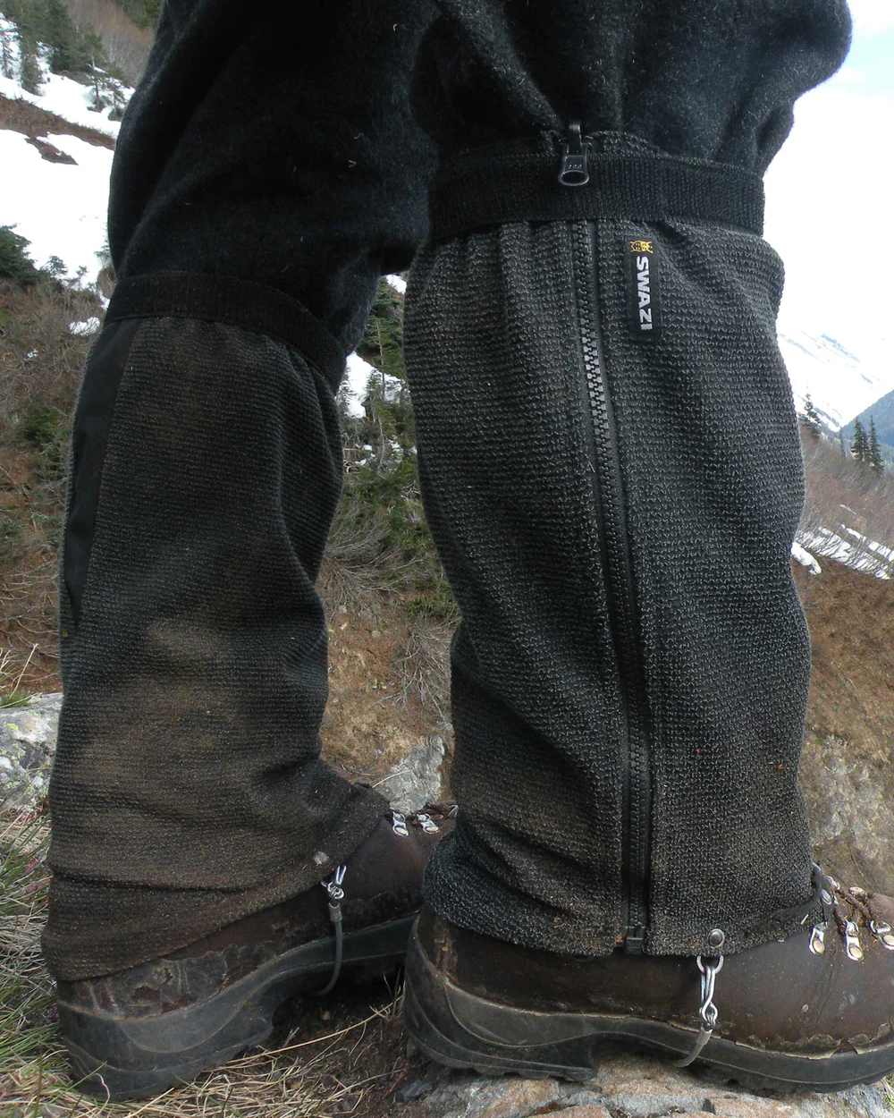 Black Coloured Swazi Ali-Gaiters On A Snow Background