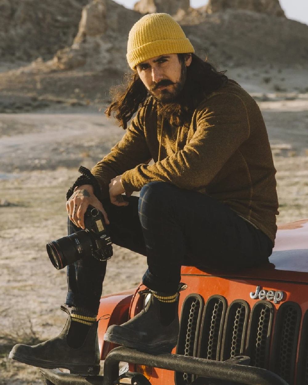 Black coloured Blundstone 566 Thermal Leather Chelsea Boots on sand background 
