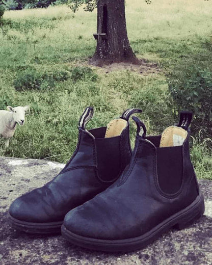 Black Coloured Blundstone Childrens 531 Black Leather Boots on outdoor background 