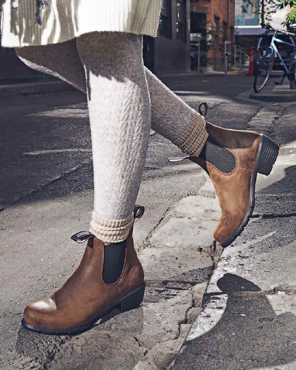 Antique Brown coloured Blundstone Womens 1673 Chelsea Boots on street background