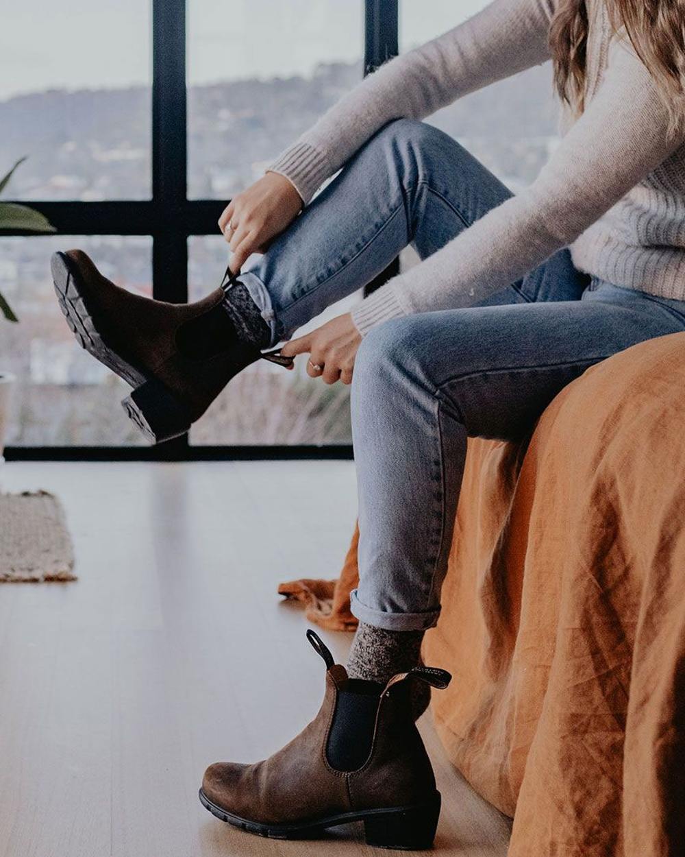 Antique Brown coloured Blundstone Womens 1673 Chelsea Boots on bedroom background