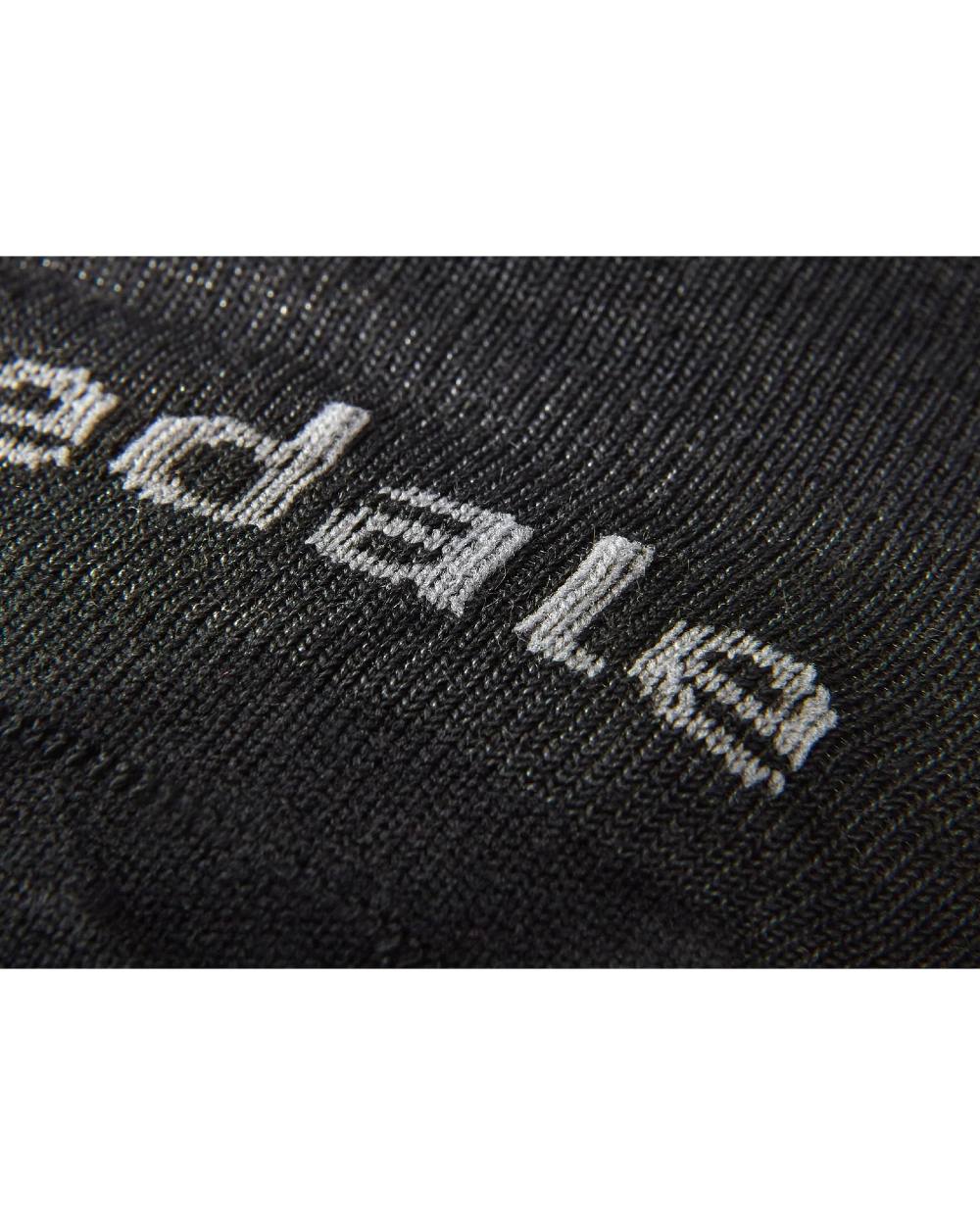 Black coloured Bridgedale Base Layer Coolmax Socks on white background 