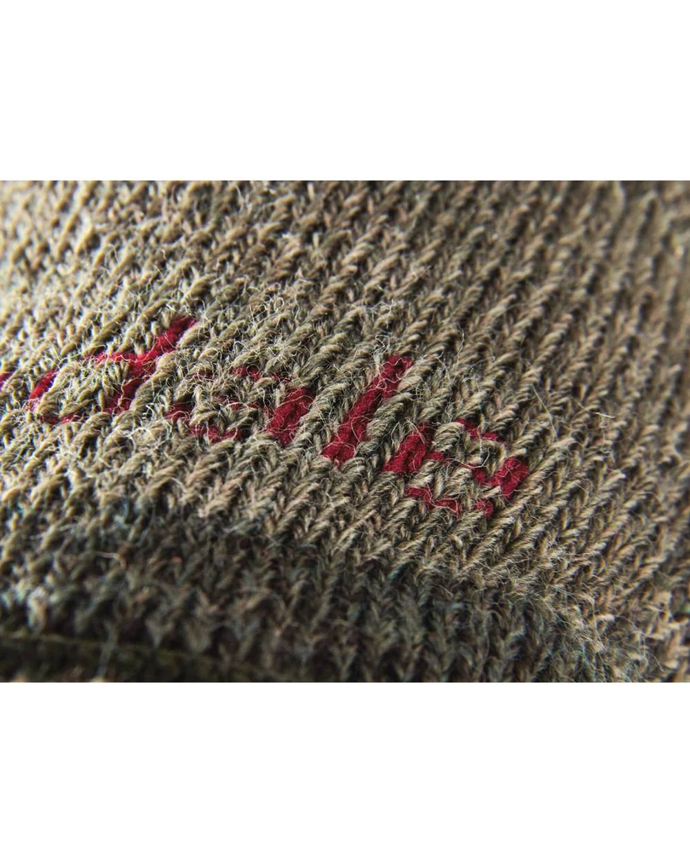 Green coloured Bridgedale Heavyweight Merino Performance Knee Socks on white background 