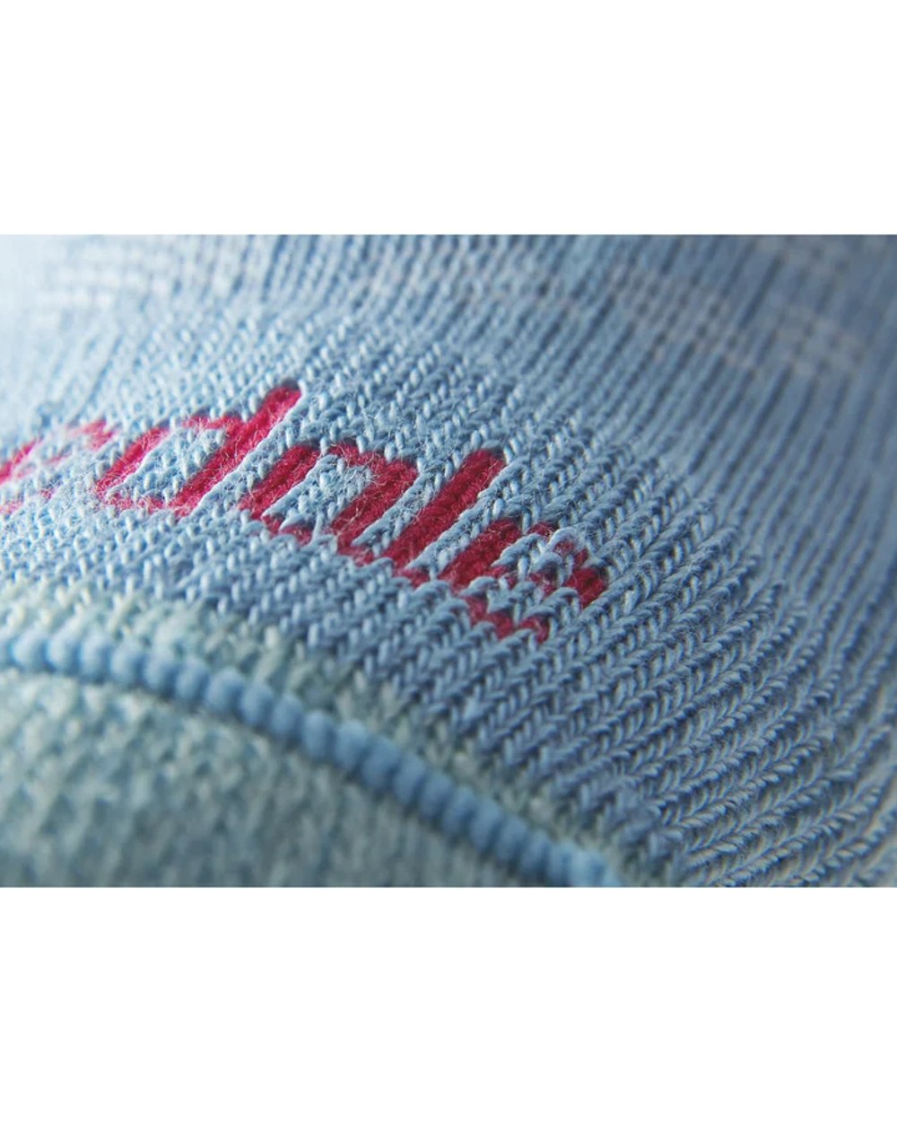 Close up Powder Blue coloured Bridgedale Womens Lightweight Merino Comfort Boot Socks on a white background 