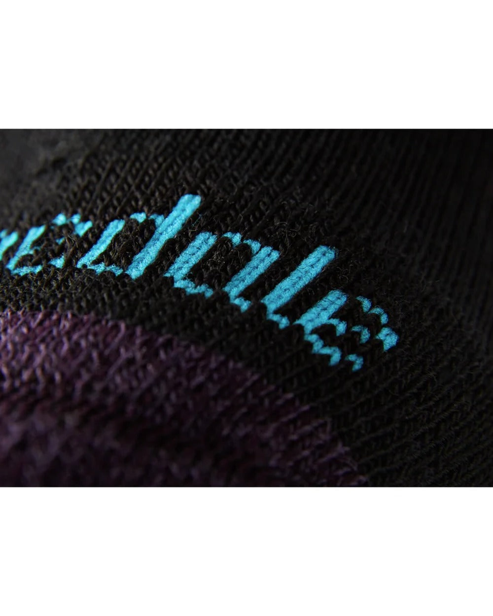 Close up of Black/Purple coloured Bridgedale Womens Lightweight Merino Performance Socks on white background 